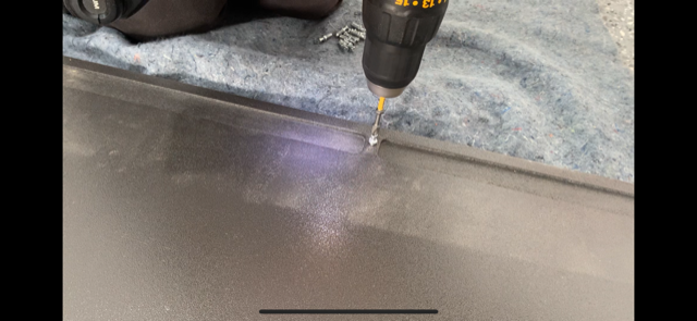 Drill installing hinge mount into pre-drilled hole