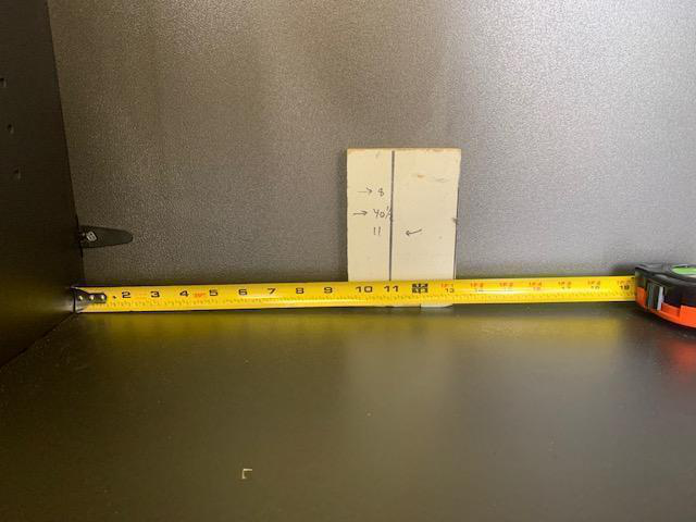 6-inch wooden block used as drill guide inside cabinet