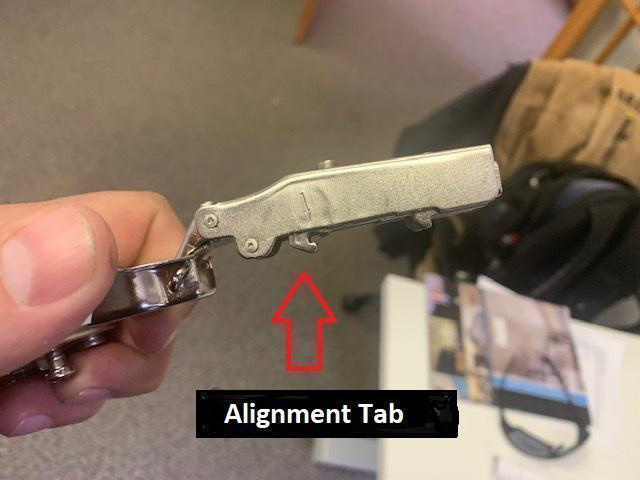 Hinge alignment tab detail