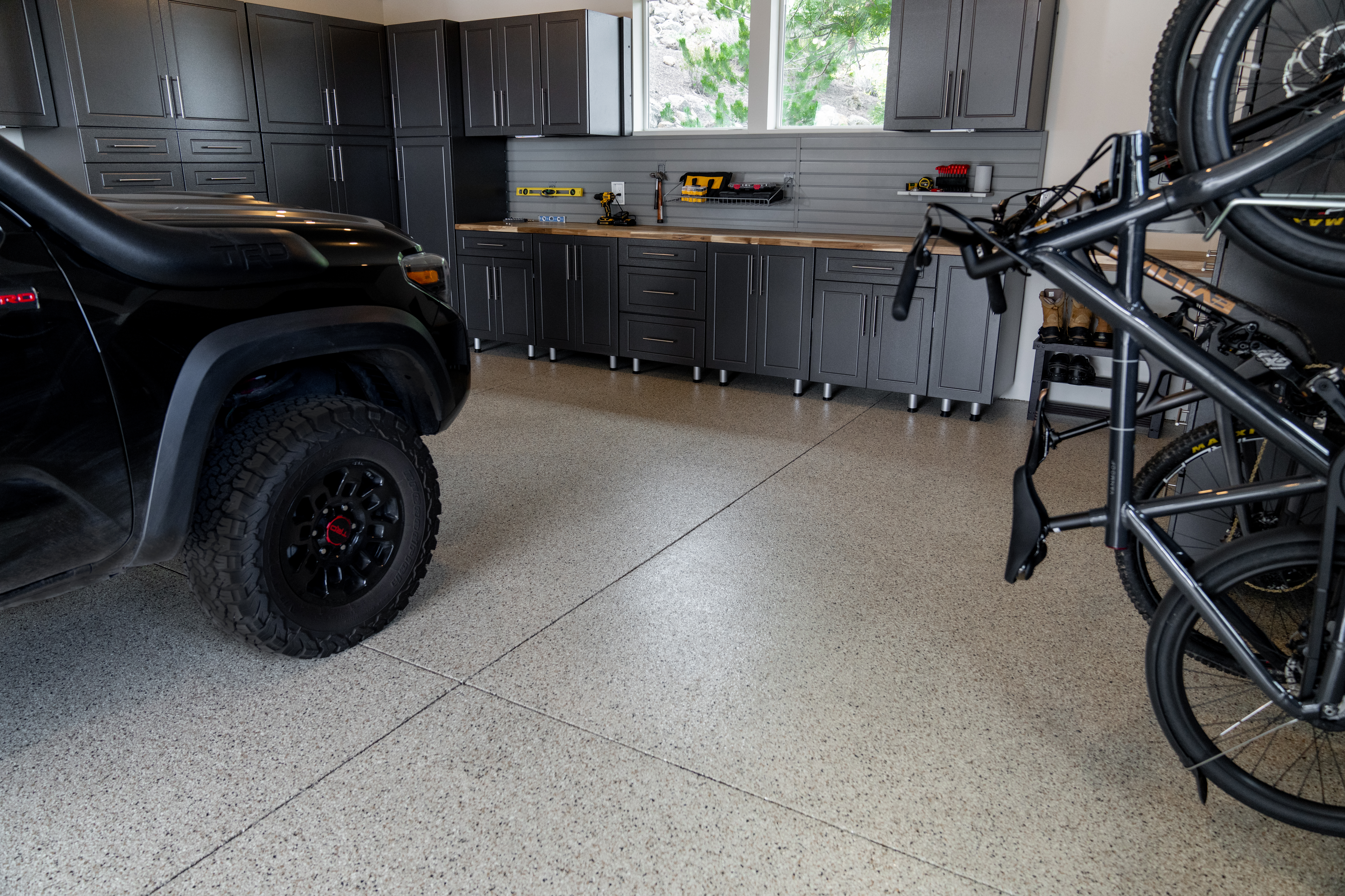 Professional slatwall installation with cabinets